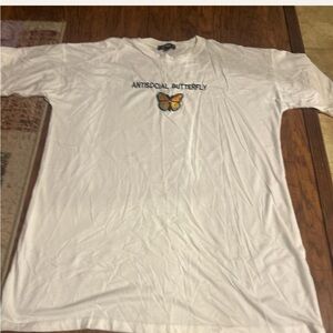 T-shirt with “ANTISOCIAL BUTTERFLY” on the front.